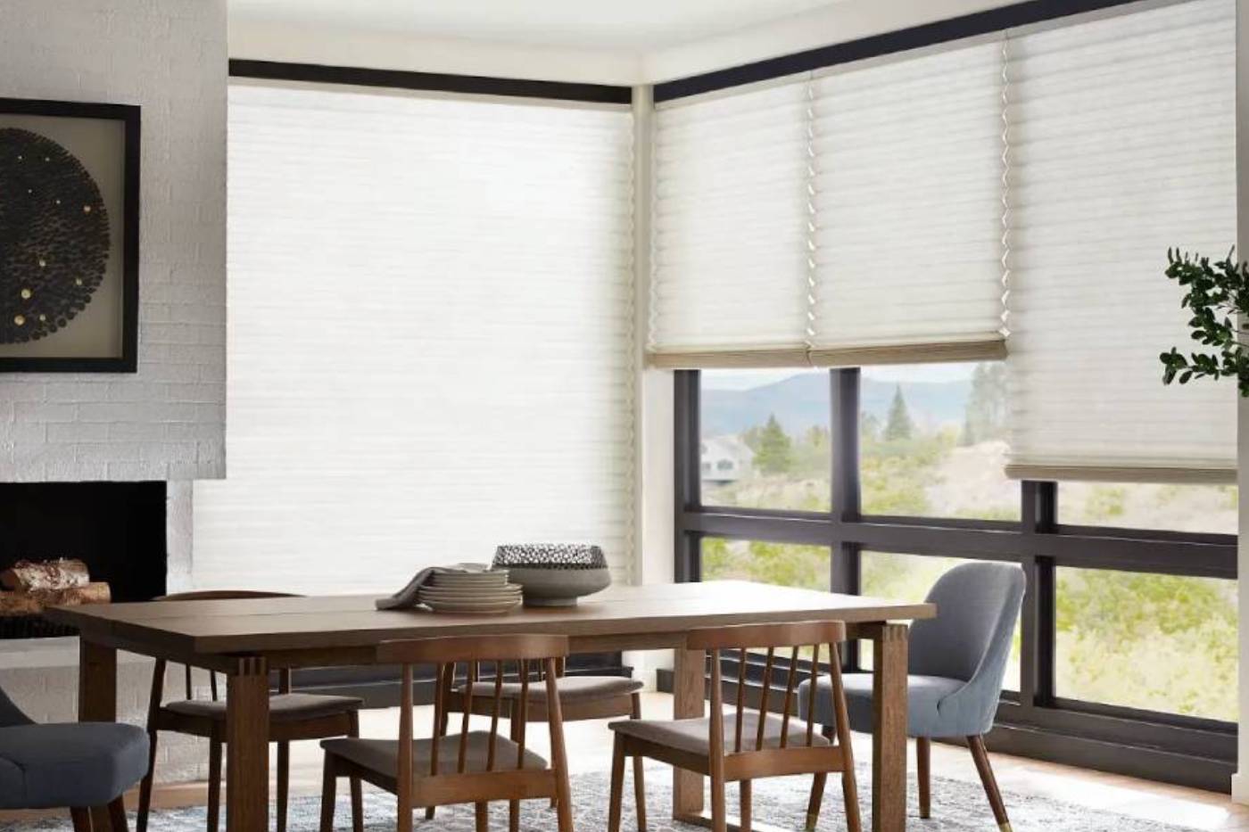 Alta® Honeycomb Shades covering dining room windows.
