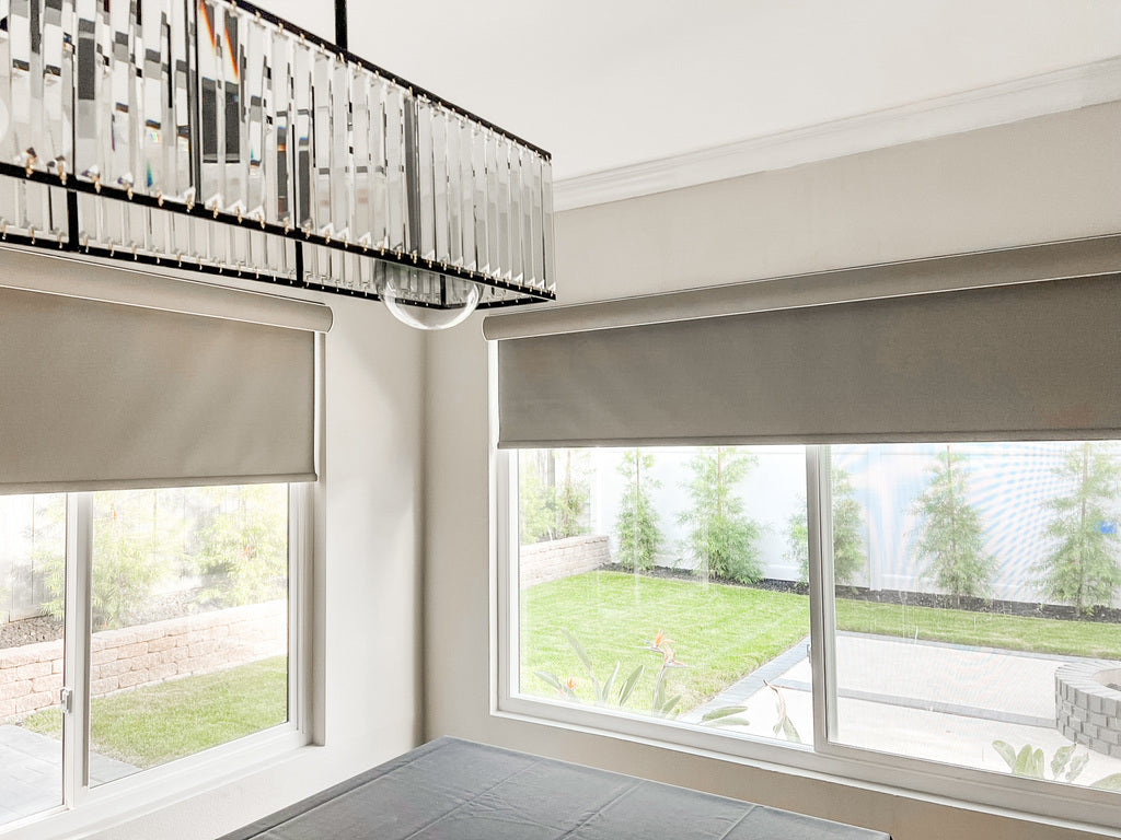 Roller Shades with curved fabric wrapped cassette in Dining Room in Orange County, CA. 